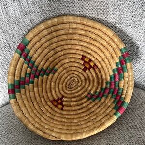 Vintage hand woven coil round basket natural material pink green accents 9.5”